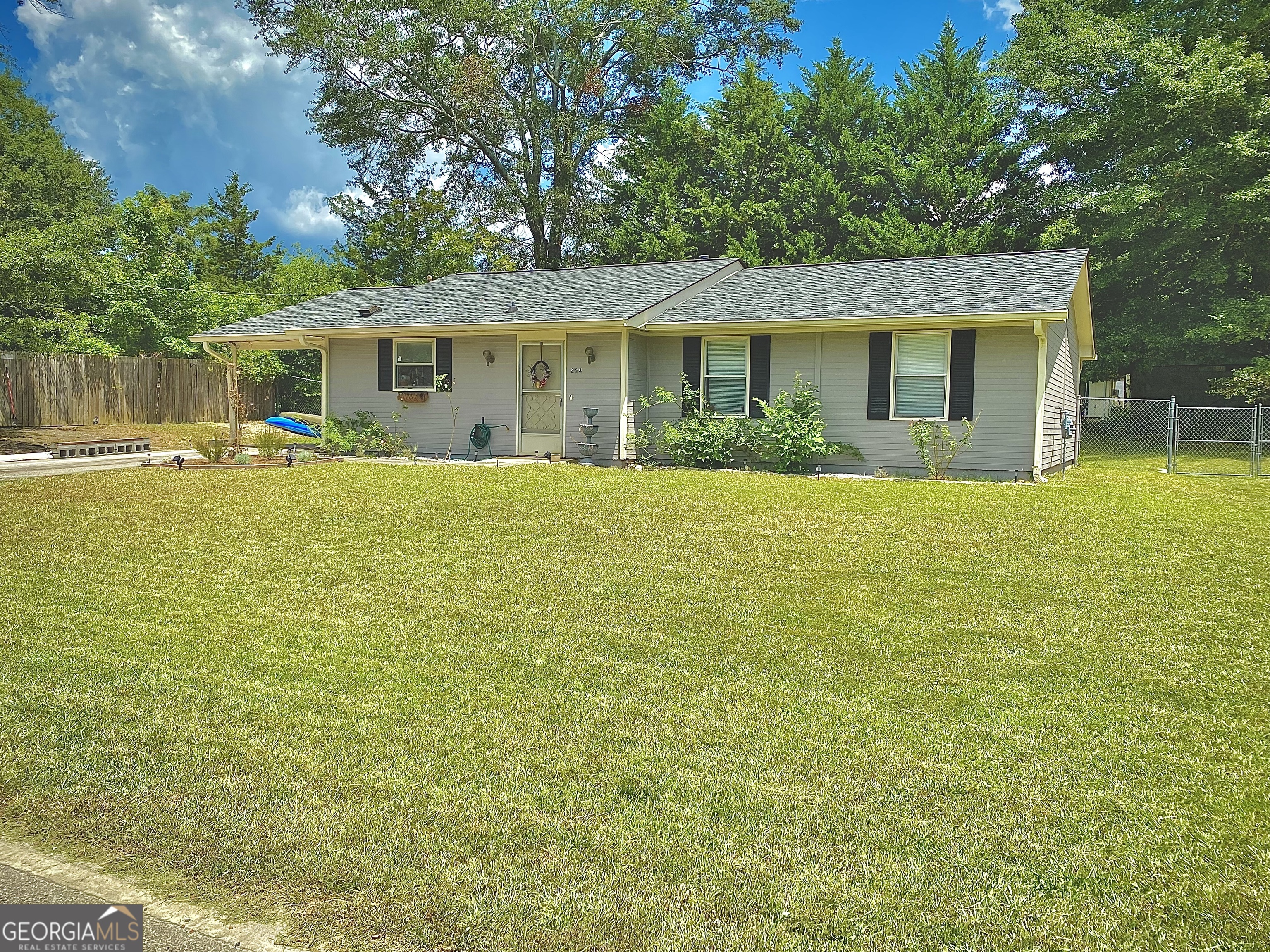 253 Stancil Drive Toccoa, GA 30577 - Photo 3 of 26 a view of a house with swimming pool and a yard