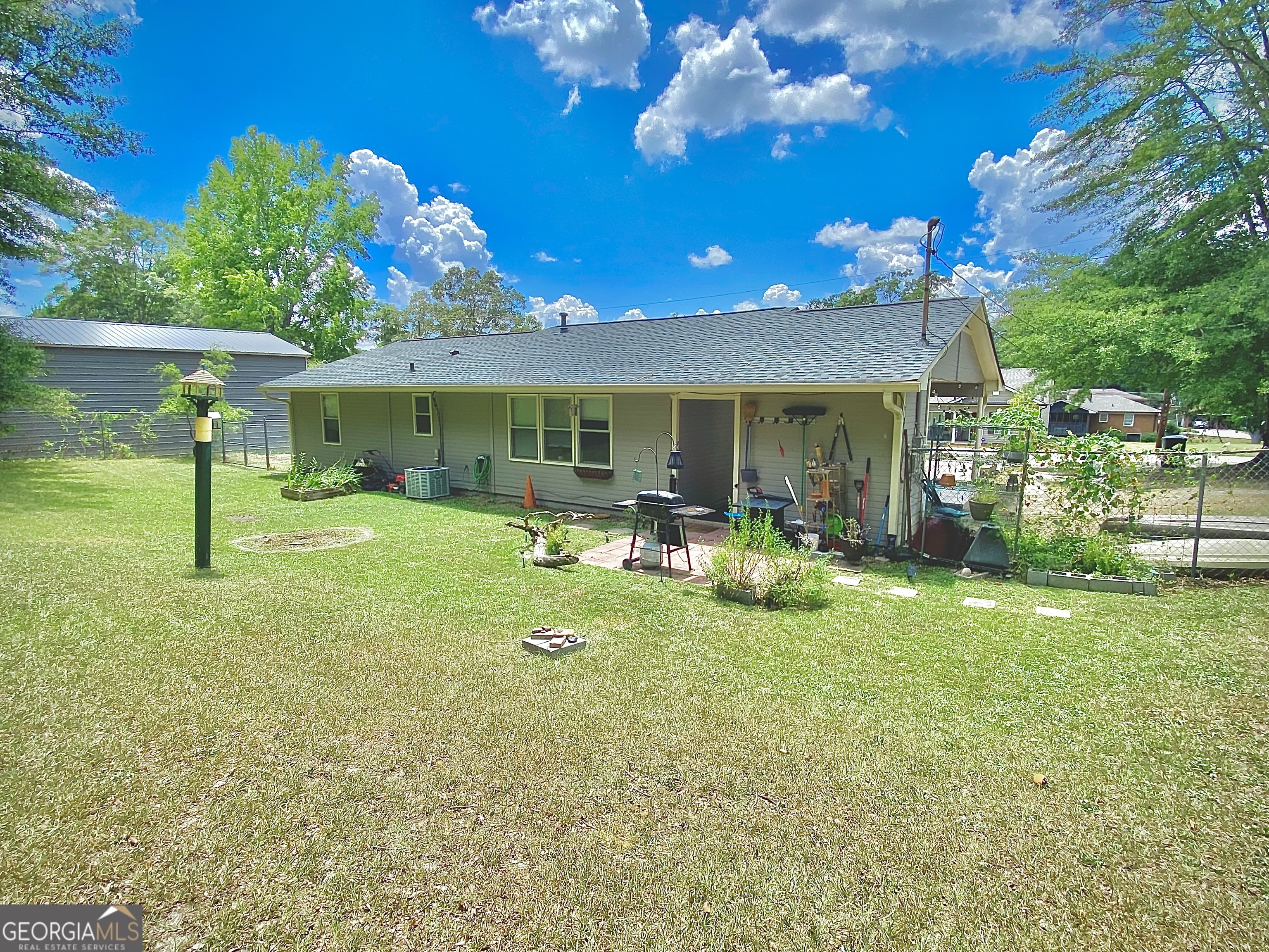 253 Stancil Drive Toccoa, GA 30577 - Photo 8 of 26 a view of a house with a backyard porch and sitting area