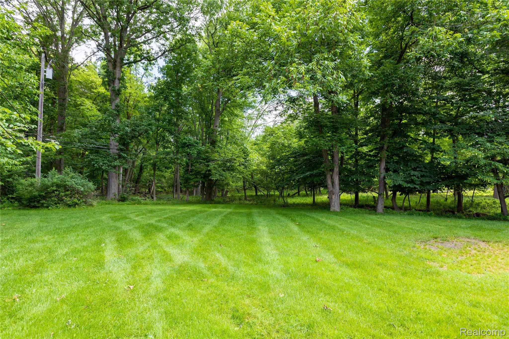 8416 Rucker Road Grosse Ile, MI 48138 - Photo 30 of 37 Just a beautiful serene yard backs to acres of Township Open Space.