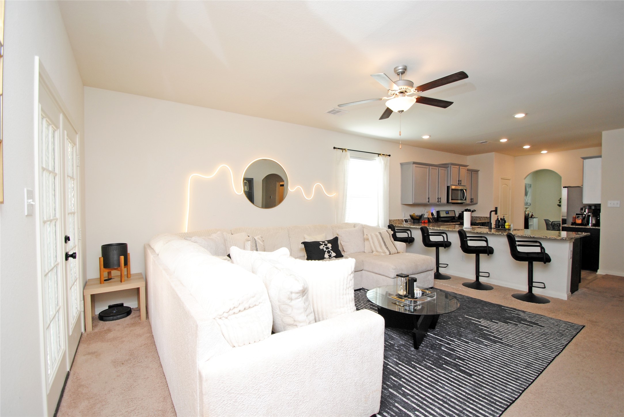 2133 Mule Ridge Drive Katy, TX 77493 - Photo 12 of 25 a living room with lots of furniture and view of kitchen