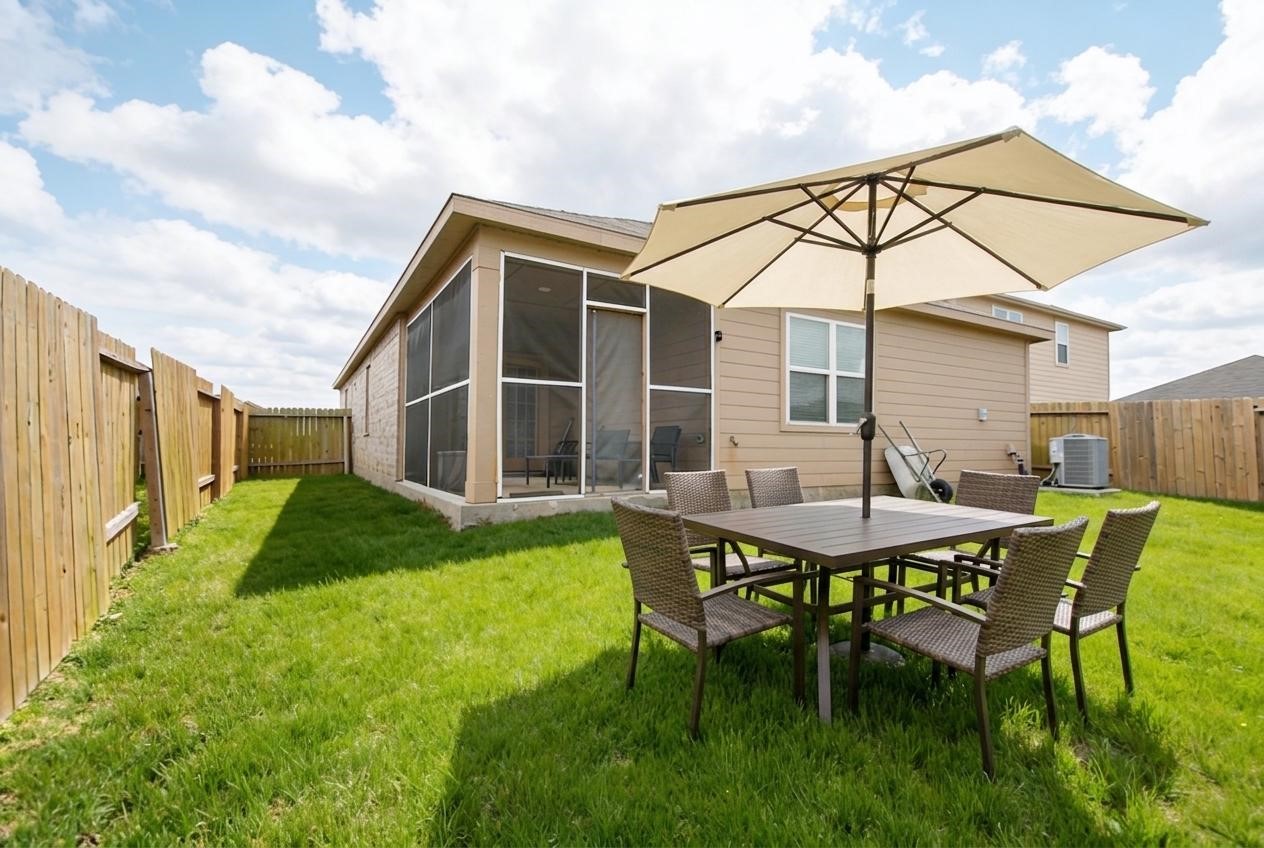 2133 Mule Ridge Drive Katy, TX 77493 - Photo 24 of 25 a backyard of a house with table and chairs