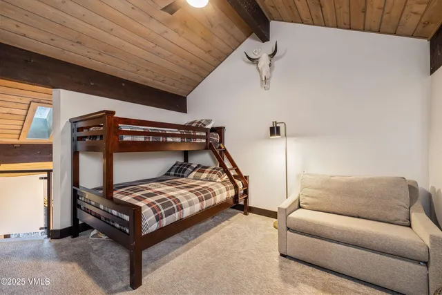 a bed room with a bed and a couch