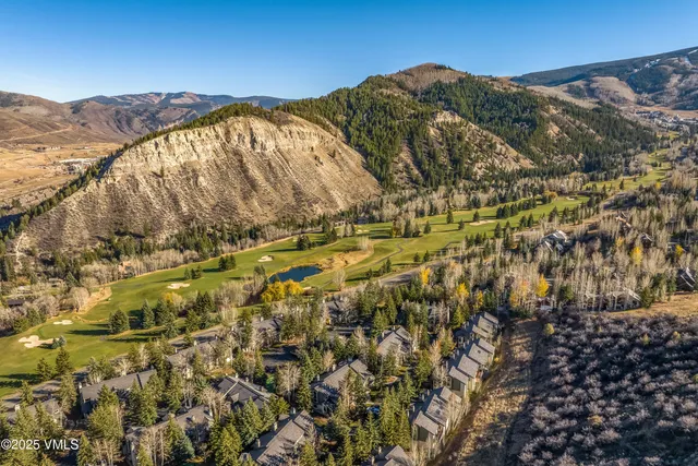 a view of a city with mountains in the background