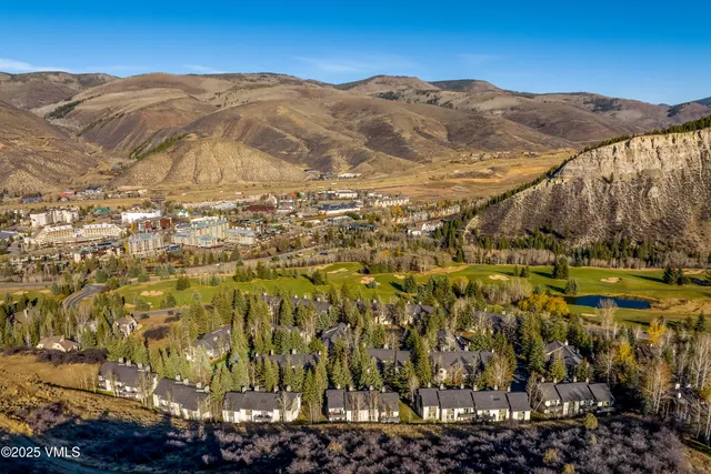 a view of a city with mountains in the background
