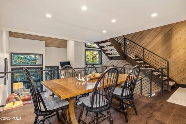 a view of a dining room with furniture and window