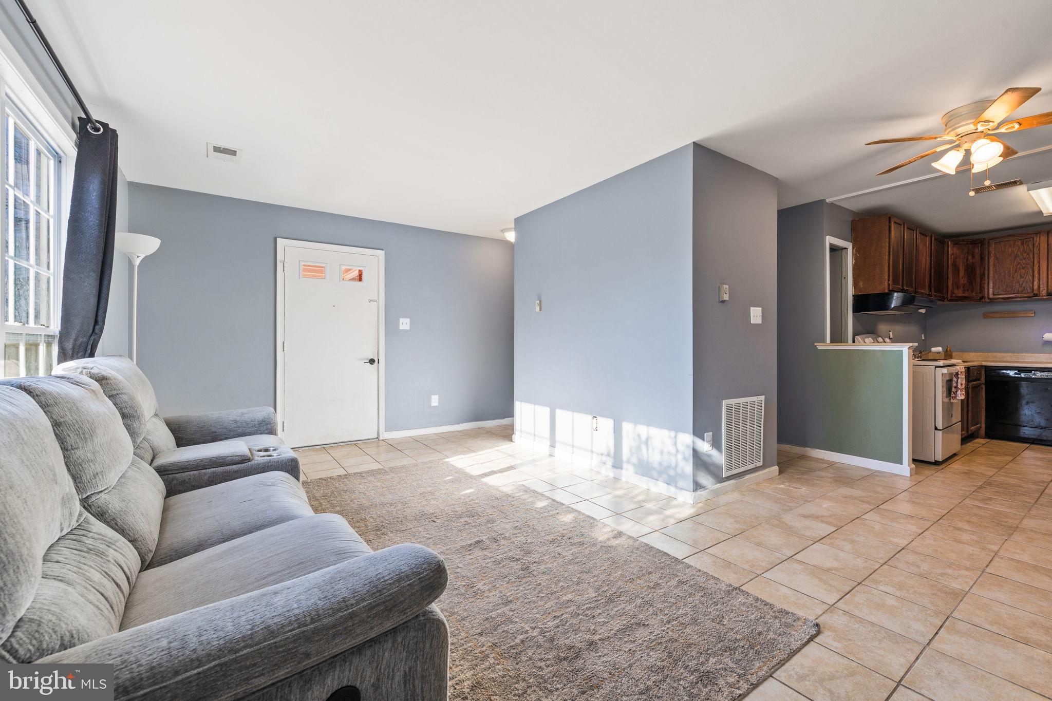 7699 Callan Drive Manassas, VA 20109 - Photo 3 of 11 a living room with furniture and a fireplace