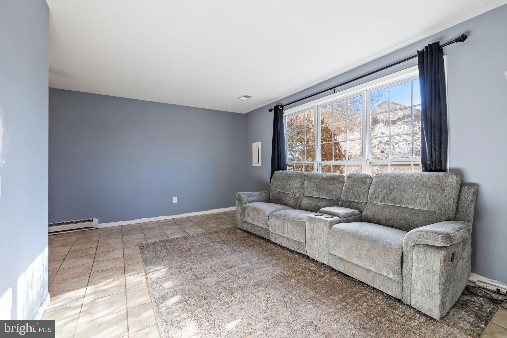 7699 Callan Drive Manassas, VA 20109 - Photo 4 of 11 a living room with furniture and a large window