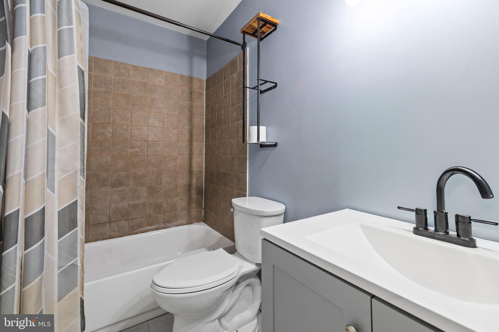 7699 Callan Drive Manassas, VA 20109 - Photo 8 of 11 a bathroom with a sink toilet and shower
