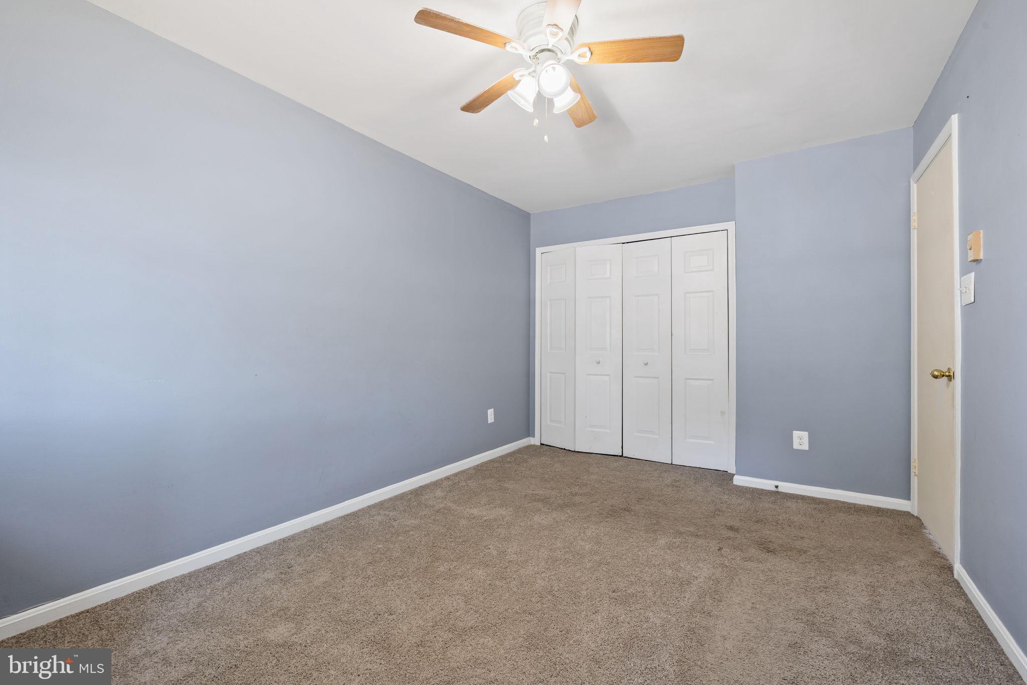 7699 Callan Drive Manassas, VA 20109 - Photo 10 of 11 a view of an empty room and chandelier fan