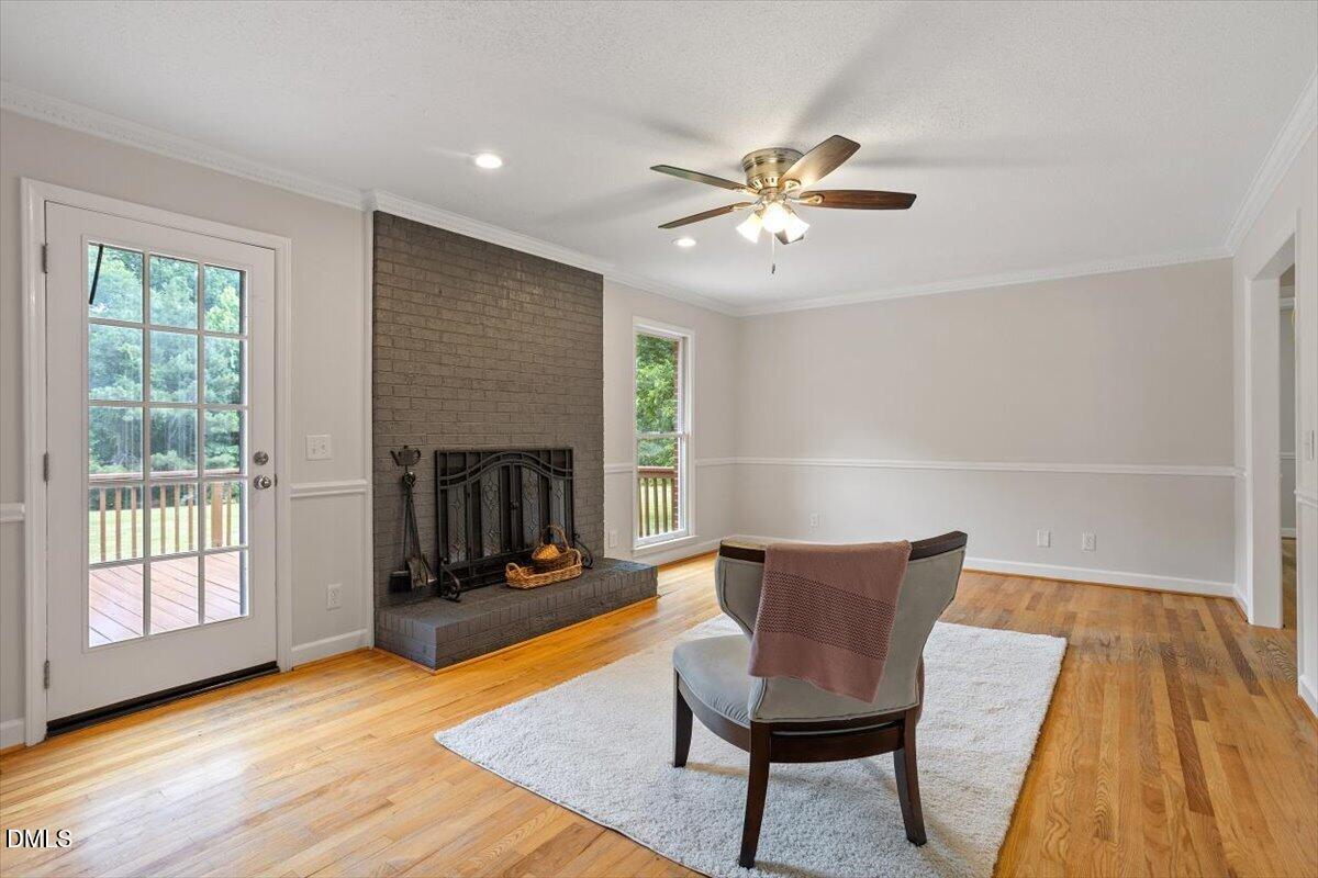 805 Rand Road Garner, NC 27529 - Photo 20 of 38 a living room with furniture and a fireplace