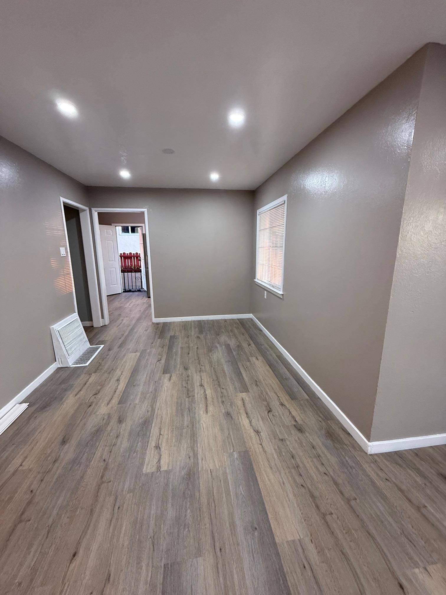 17028 Santa Fe Street Hayward, CA 94541 - Photo 20 of 54 a view of empty room with wooden floor