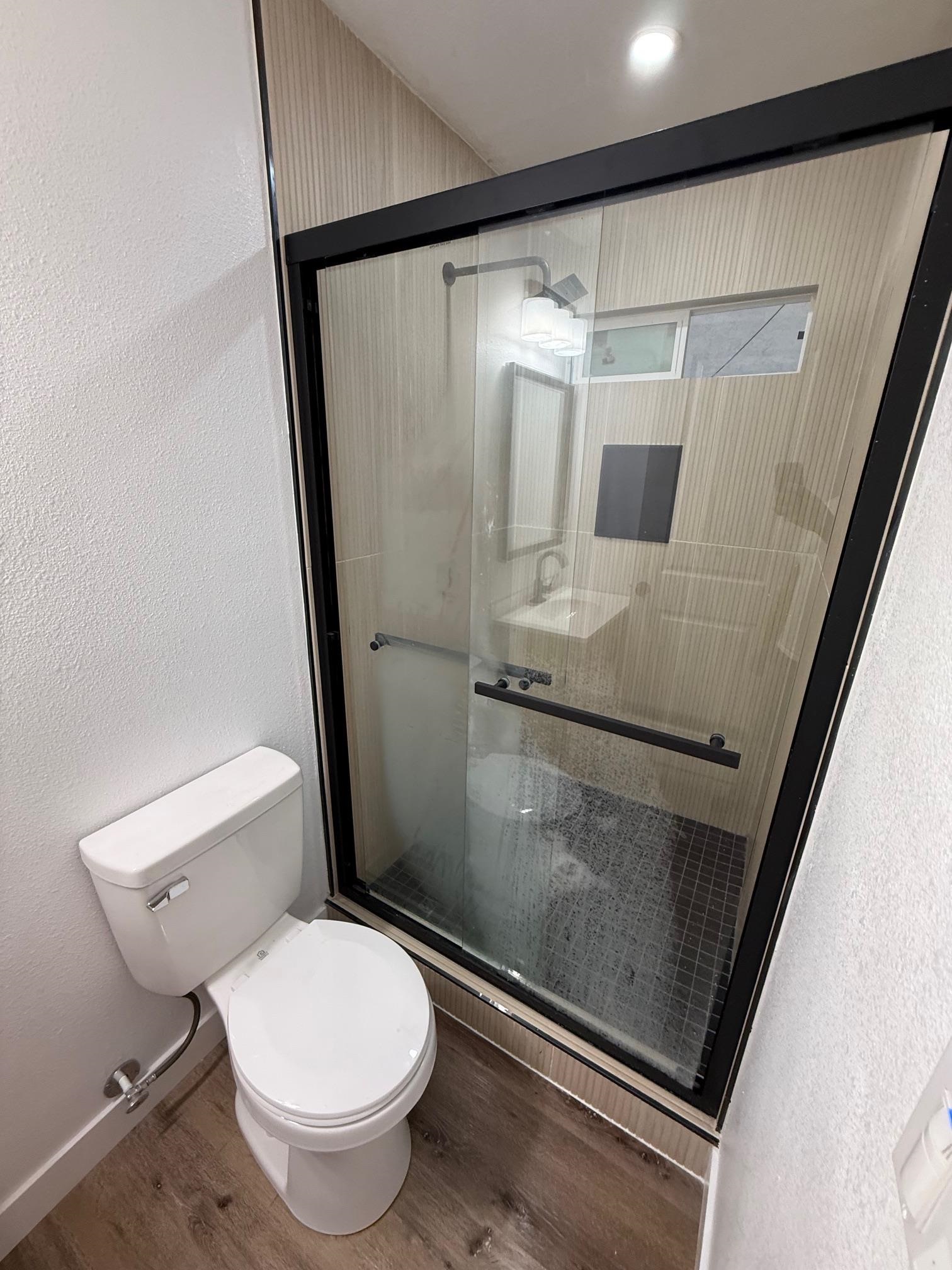 17028 Santa Fe Street Hayward, CA 94541 - Photo 4 of 54 a bathroom with a toilet and a shower