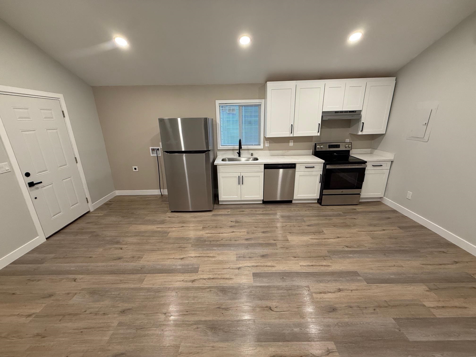 17028 Santa Fe Street Hayward, CA 94541 - Photo 41 of 54 a large kitchen with a large counter top stainless steel appliances and cabinets