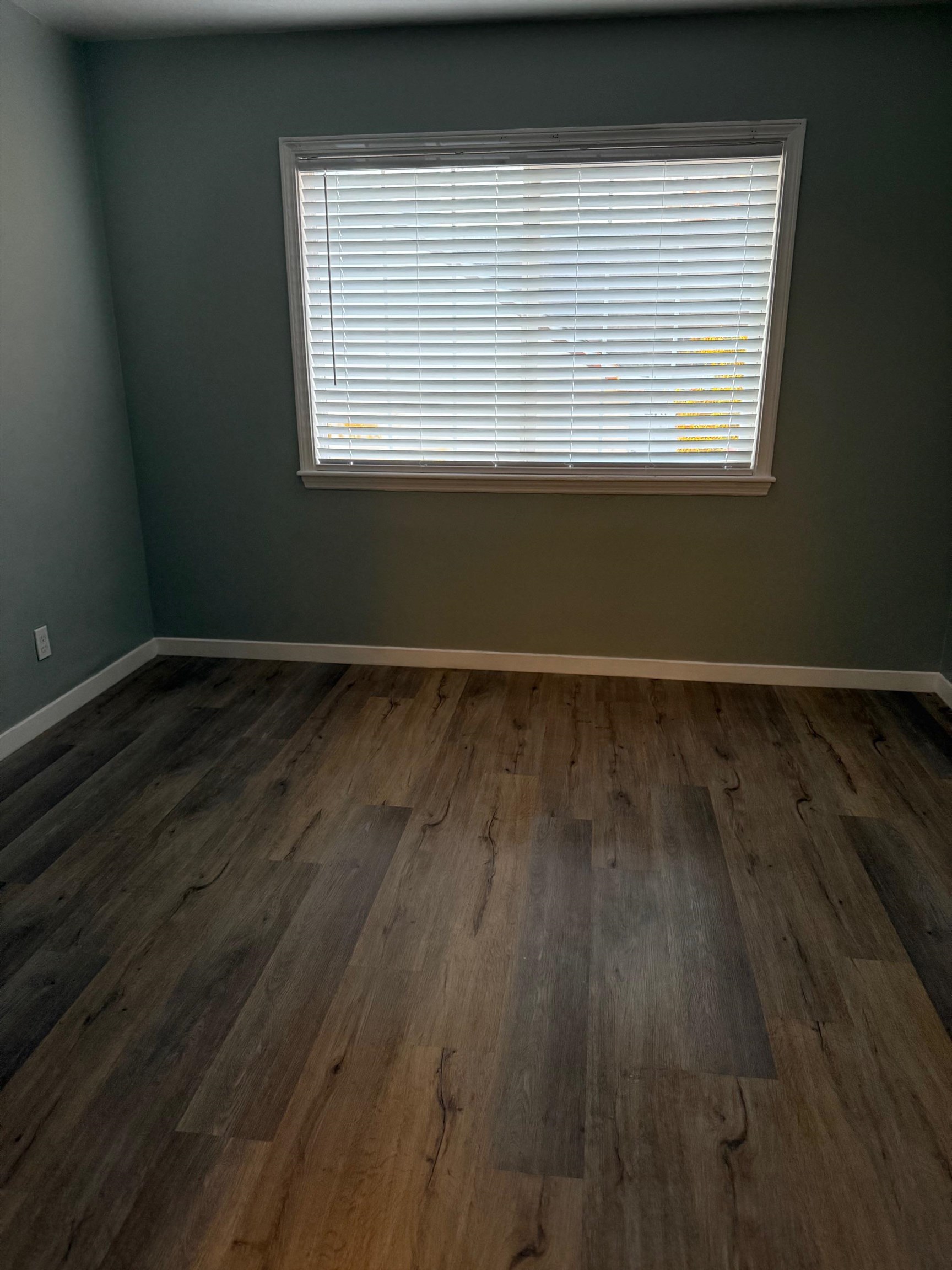 17028 Santa Fe Street Hayward, CA 94541 - Photo 5 of 54 an empty room with wooden floor and windows