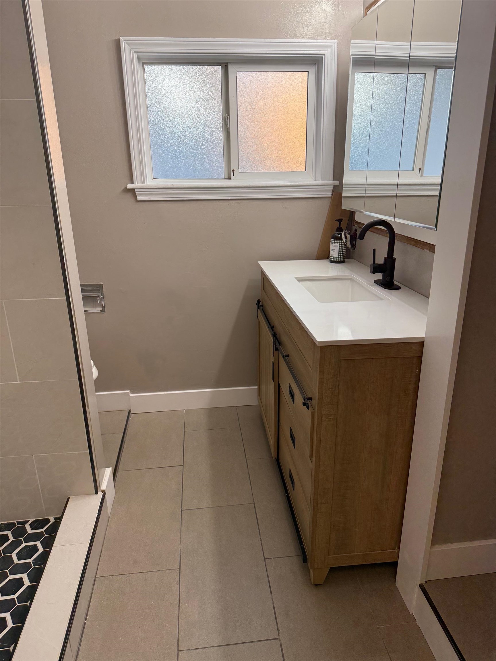 17028 Santa Fe Street Hayward, CA 94541 - Photo 8 of 54 a utility room with mirror and sink