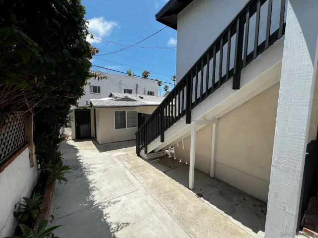 a view of house with outdoor space and wooden floor