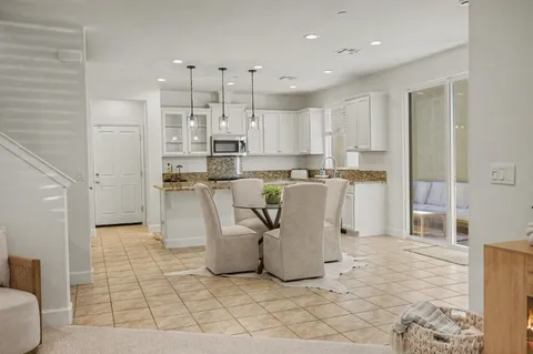a kitchen with stainless steel appliances a refrigerator sink and cabinets