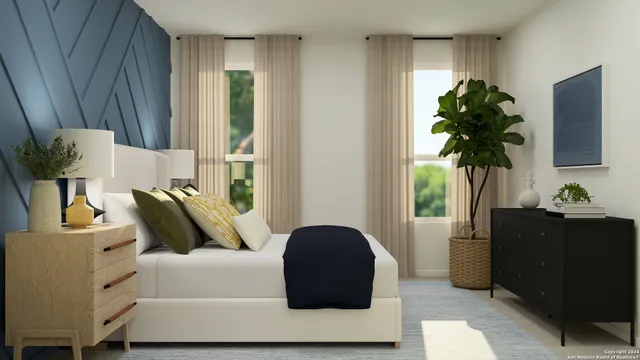 a bedroom with a bed a desk and chair