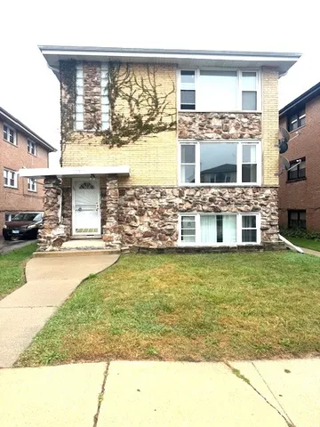 a view of swimming pool with lawn chairs and large window