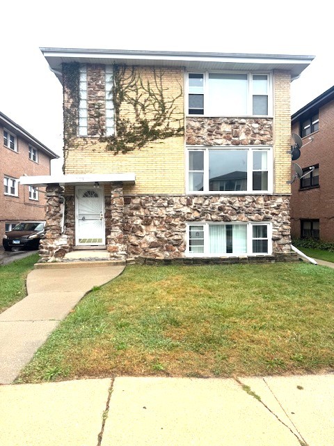 339 Yates Avenue, Unit 1 Calumet City, IL 60409 - Photo 1 of 1 a view of swimming pool with lawn chairs and large window