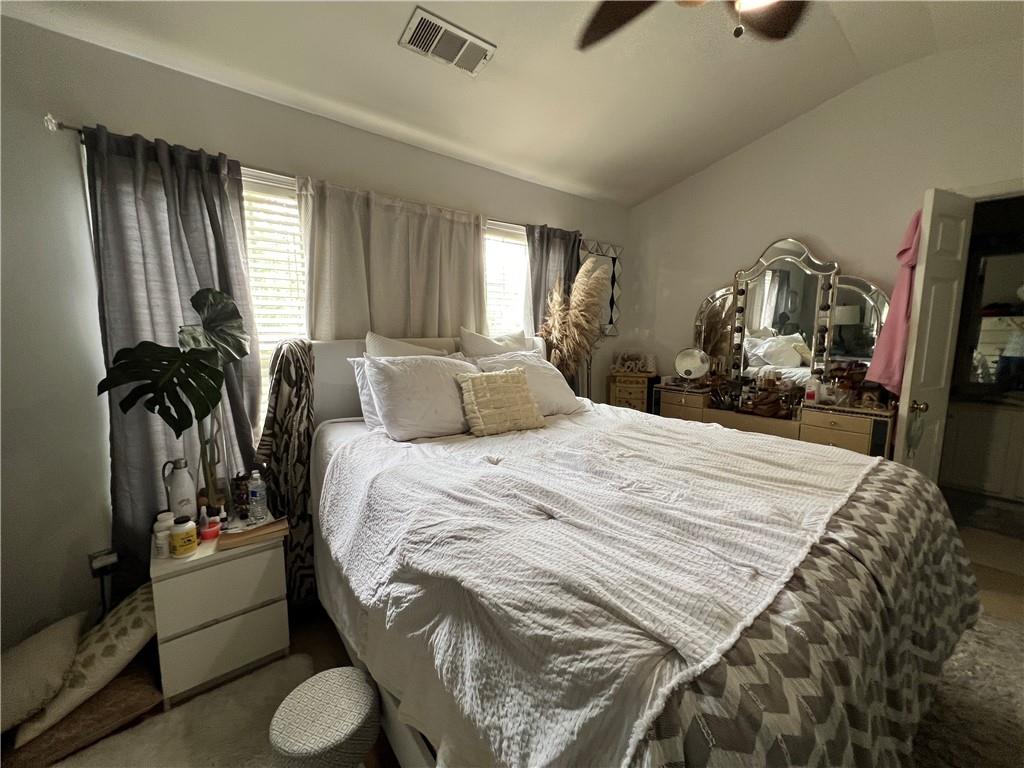 3914 Howell Park Road Duluth, GA 30096 - Photo 13 of 33 a bedroom with a bed and a flat tv screen on the dresser