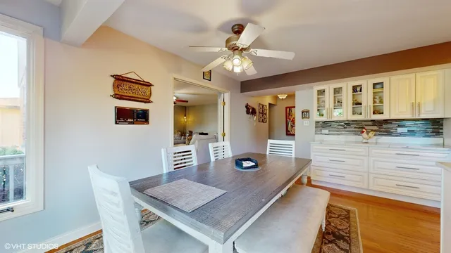 a living room with stainless steel appliances furniture and a window