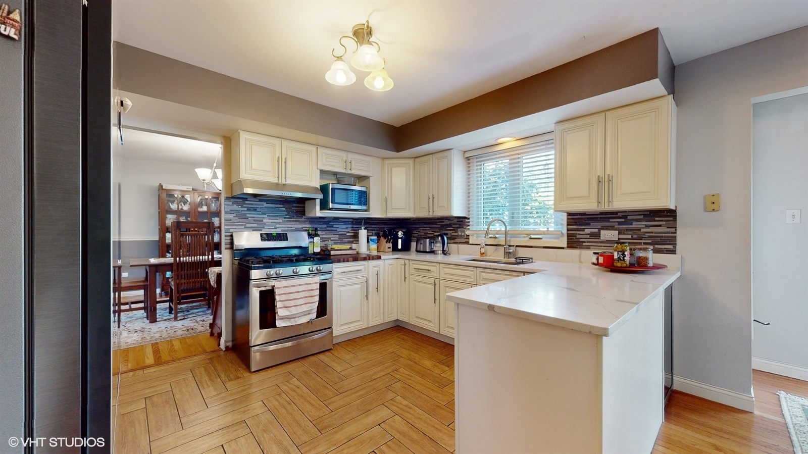 14467 Creekview Drive Orland Park, IL 60467 - Photo 15 of 51 a kitchen with stainless steel appliances granite countertop a stove top oven a sink dishwasher and a refrigerator
