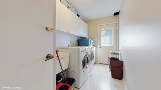 a view of storage and utility room with washer and dryer