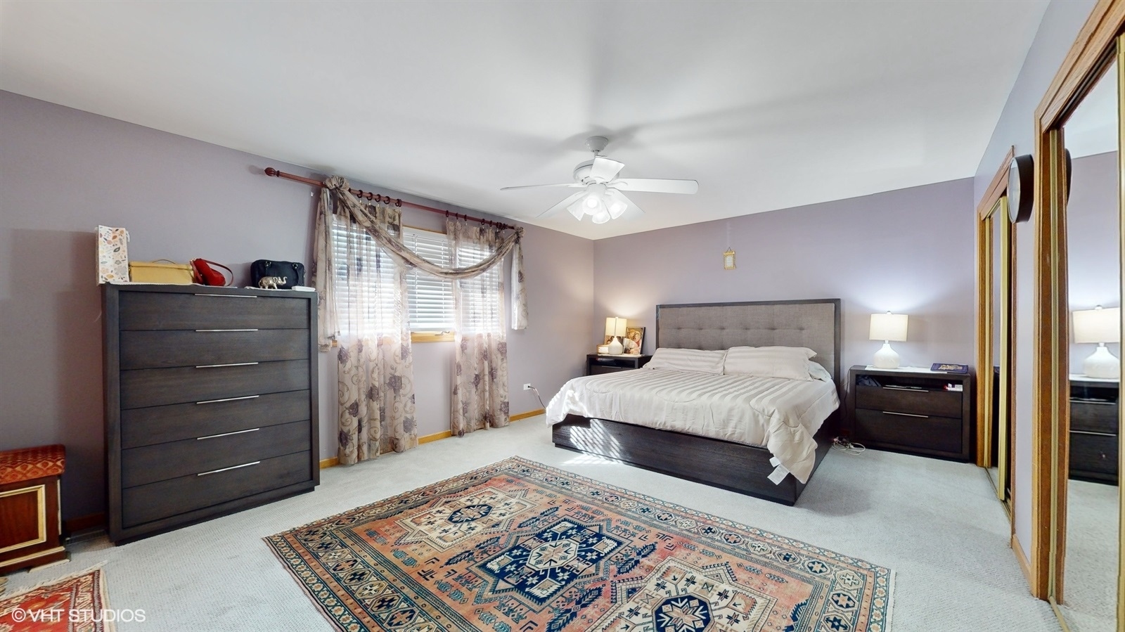 14467 Creekview Drive Orland Park, IL 60467 - Photo 21 of 51 a bedroom with a bed and a chandelier