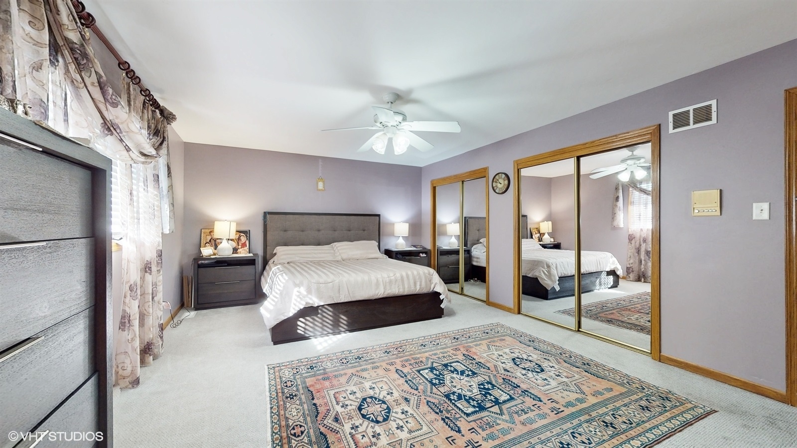 14467 Creekview Drive Orland Park, IL 60467 - Photo 23 of 51 a bedroom with a large bed and a chandelier