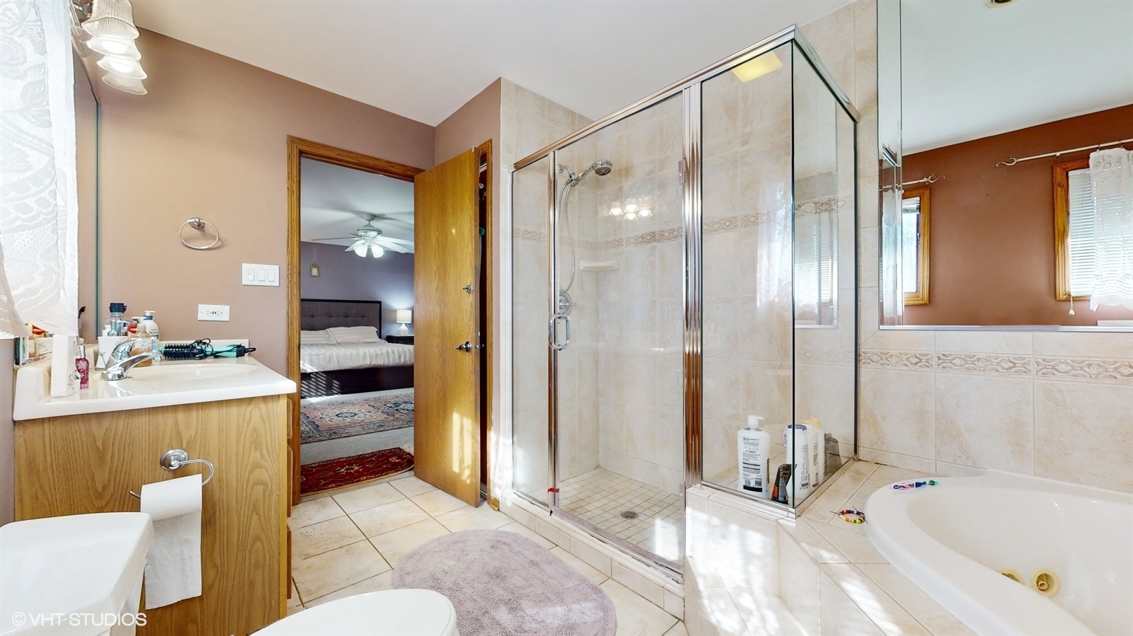 14467 Creekview Drive Orland Park, IL 60467 - Photo 25 of 51 a bathroom with a tub sink and mirror