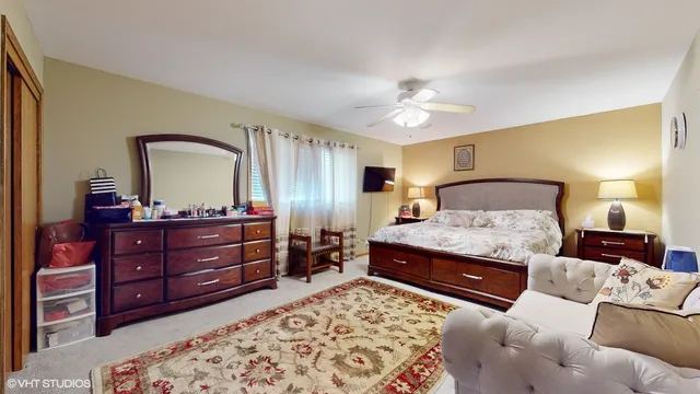 a bedroom with a bed and a dresser