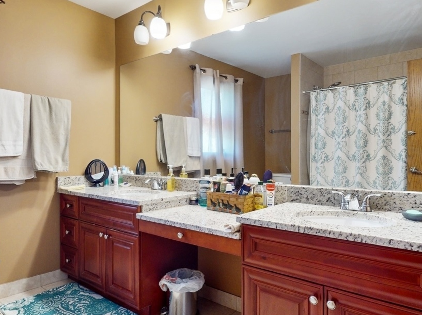 14467 Creekview Drive Orland Park, IL 60467 - Photo 35 of 51 a bathroom with a granite countertop sink and a mirror