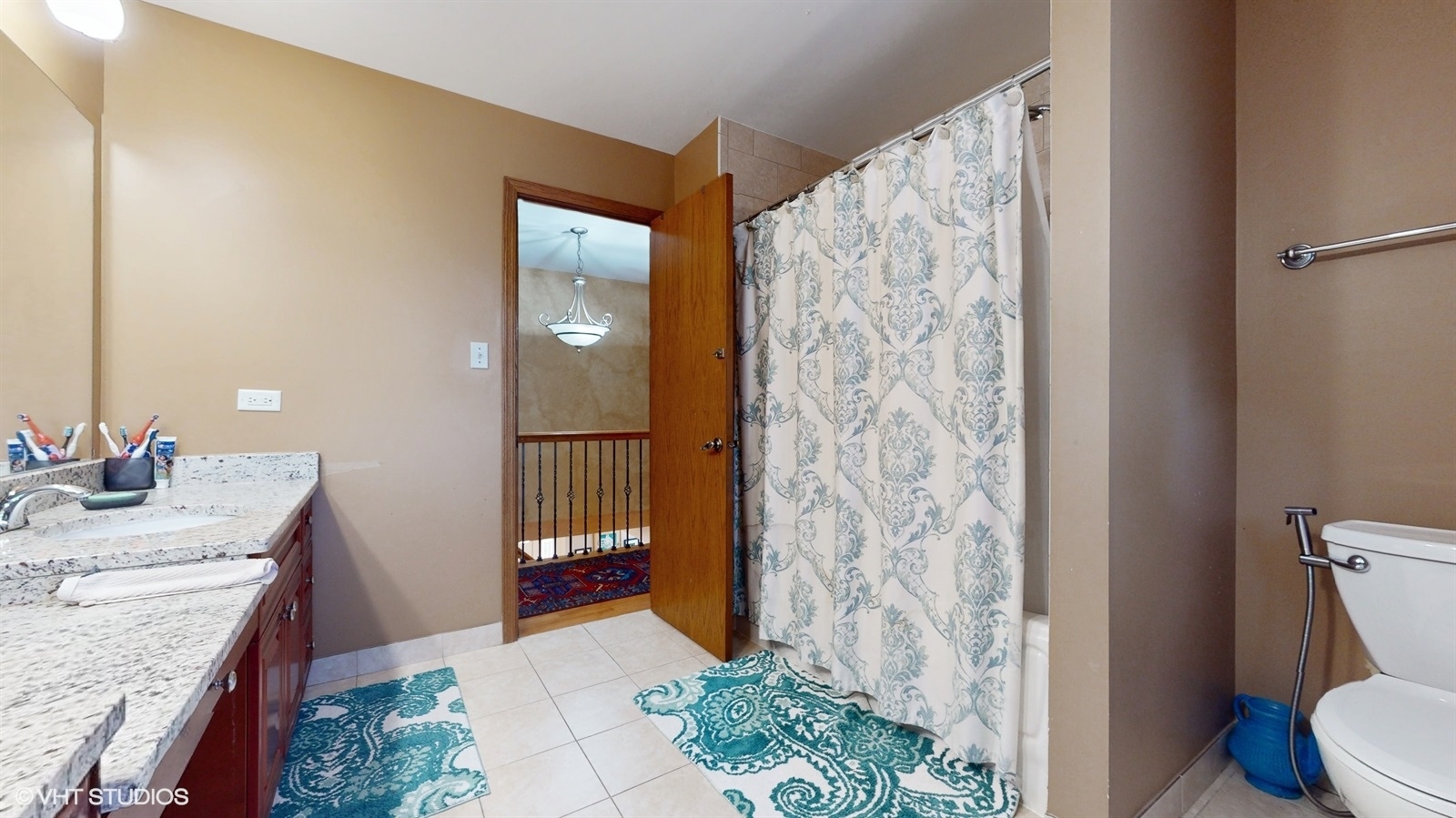 14467 Creekview Drive Orland Park, IL 60467 - Photo 36 of 51 a bathroom with a granite countertop sink a toilet and shower