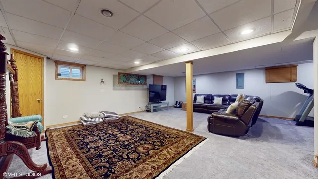 a living room with furniture and a rug