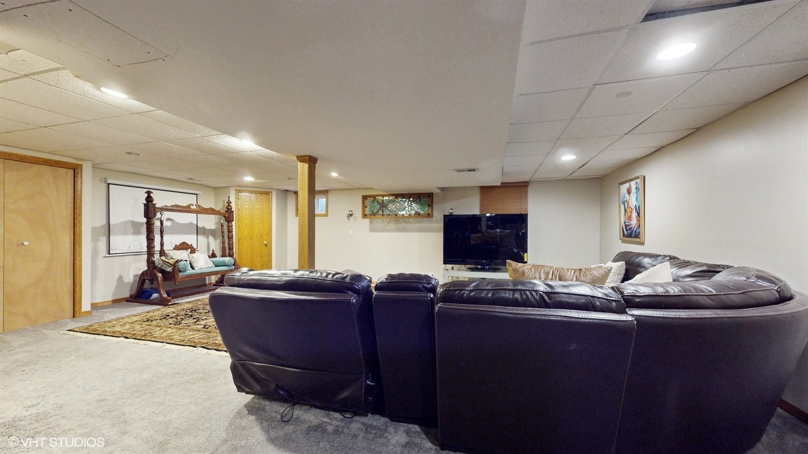 14467 Creekview Drive Orland Park, IL 60467 - Photo 39 of 51 a living room with furniture and a flat screen tv
