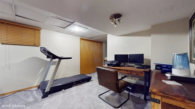 a bed room with a bed and chair