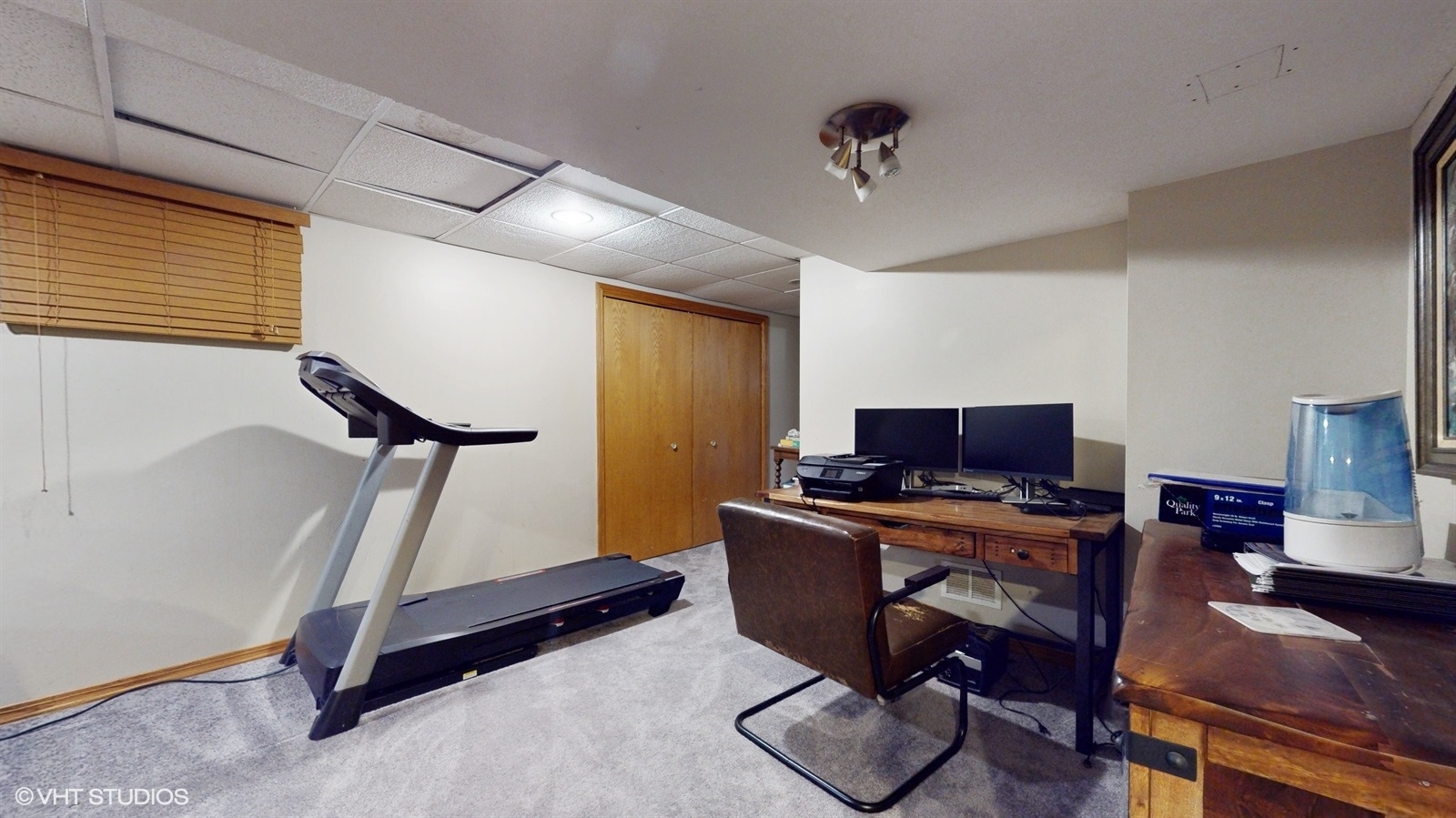 14467 Creekview Drive Orland Park, IL 60467 - Photo 40 of 51 a view of a workspace with furniture and a window