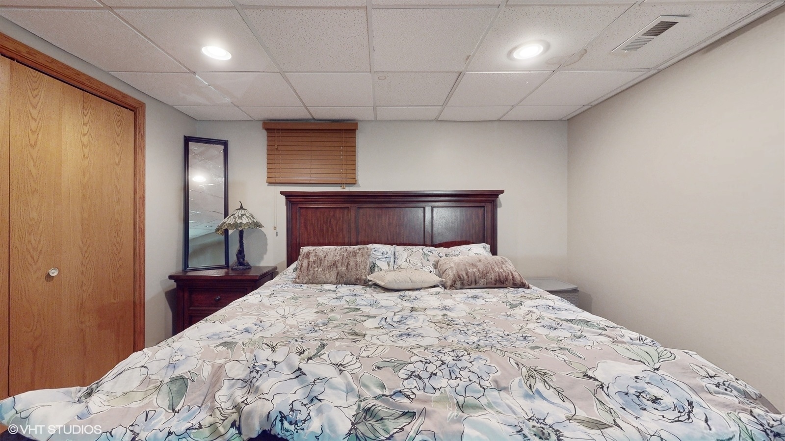 14467 Creekview Drive Orland Park, IL 60467 - Photo 43 of 51 a bedroom with a large bed and a chandelier