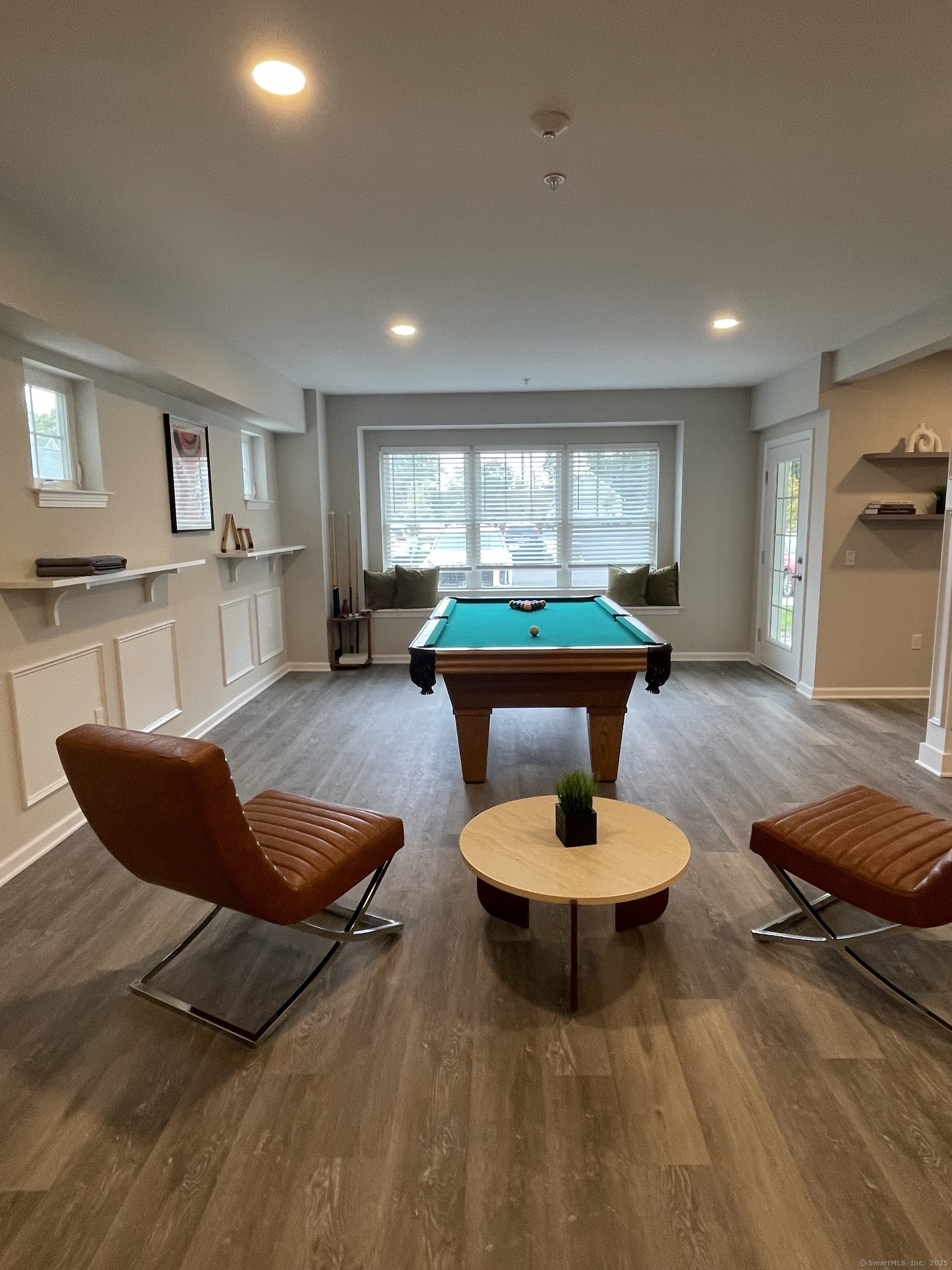 64 East Mitchell Avenue, Unit 27 Cheshire, CT 06410 - Photo 15 of 17 a living room with furniture and a wooden floor