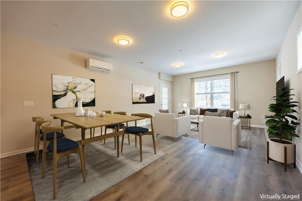 64 East Mitchell Avenue, Unit 27 Cheshire, CT 06410 - Photo 6 of 17 a view of a dining room with furniture and wooden floor