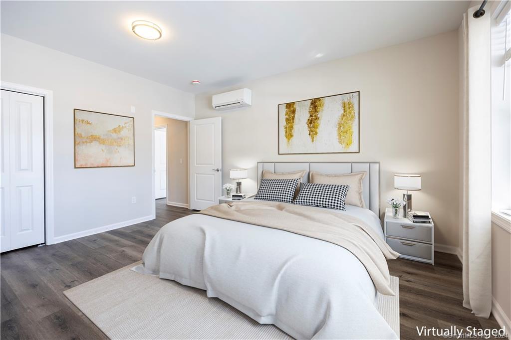 64 East Mitchell Avenue, Unit 27 Cheshire, CT 06410 - Photo 10 of 17 a bedroom with a bed and painting on the wall