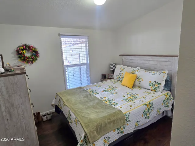 a bedroom with a bed and window