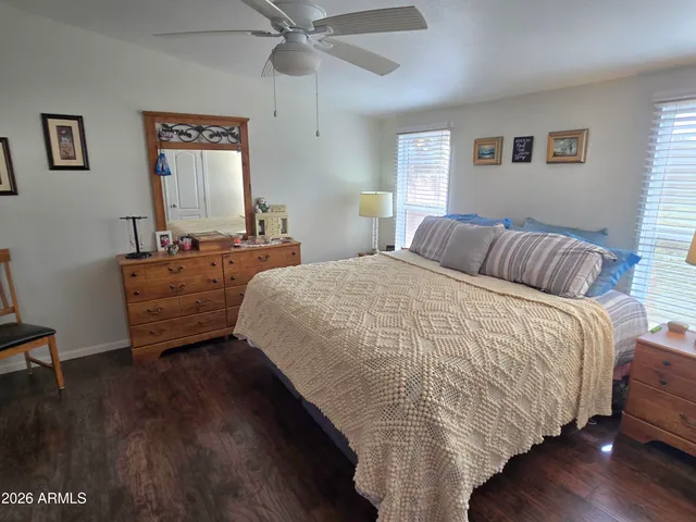 a bedroom with bed and window