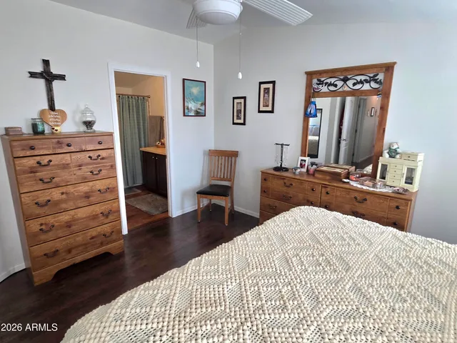 a bedroom with a bed and a dresser
