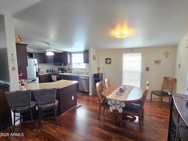 a view of a dining room with furniture and wooden floor