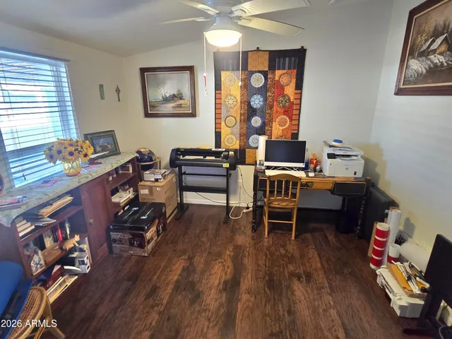 a workspace with furniture hardwood and a window