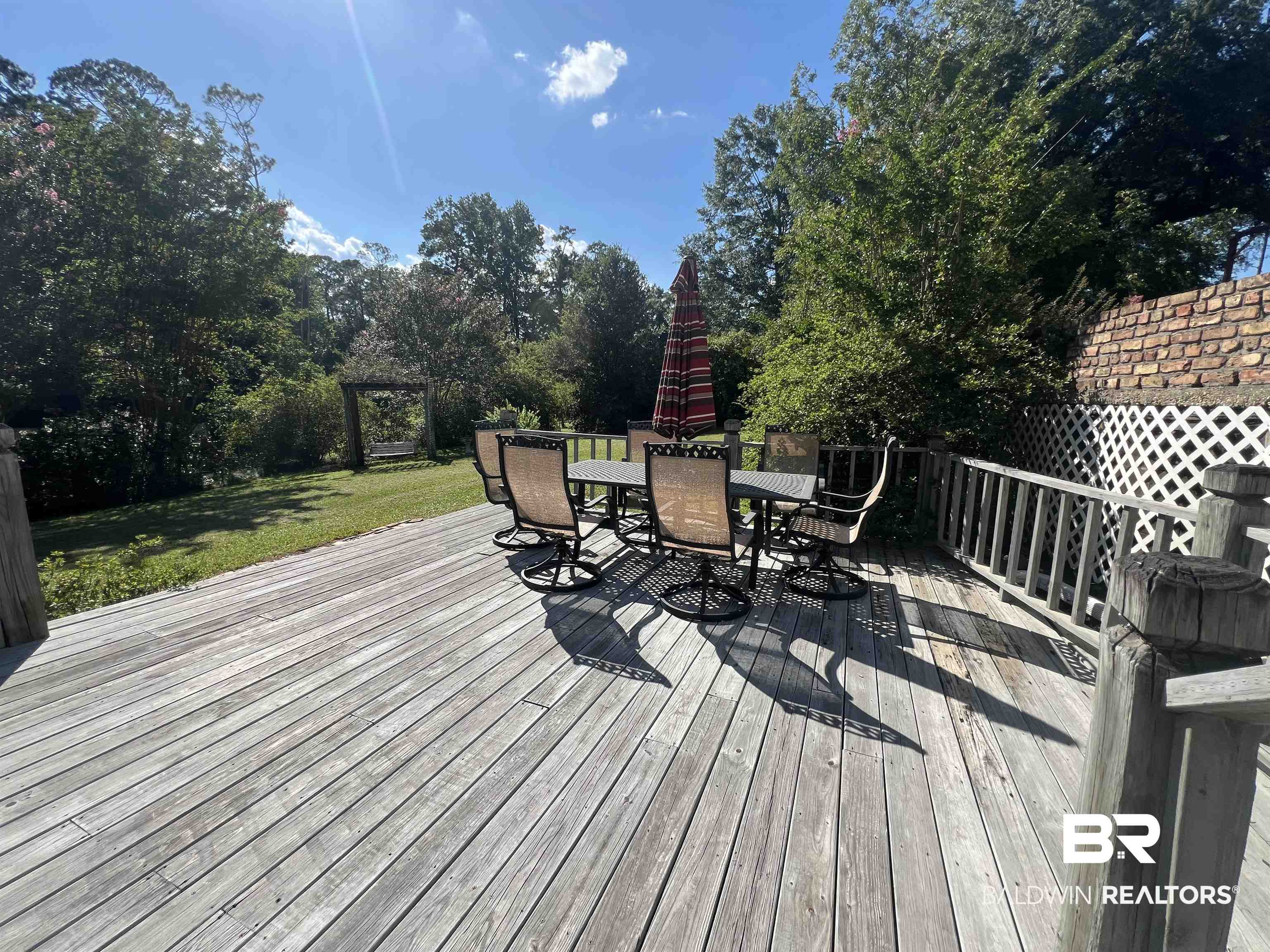 2691 Appleton Road Brewton, AL 36426 - Photo 49 of 60 Wooden deck featuring outdoor dining space and a yard