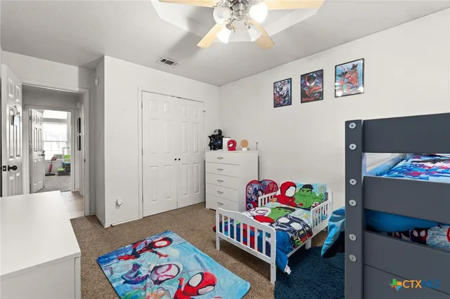 a bedroom with furniture and a couch