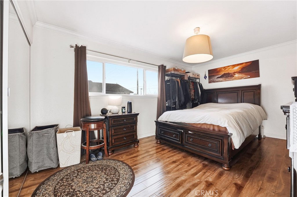 11908 Fallingleaf Circle Garden Grove, CA 92840 - Photo 12 of 30 a bedroom with a bed and dresser with mirror